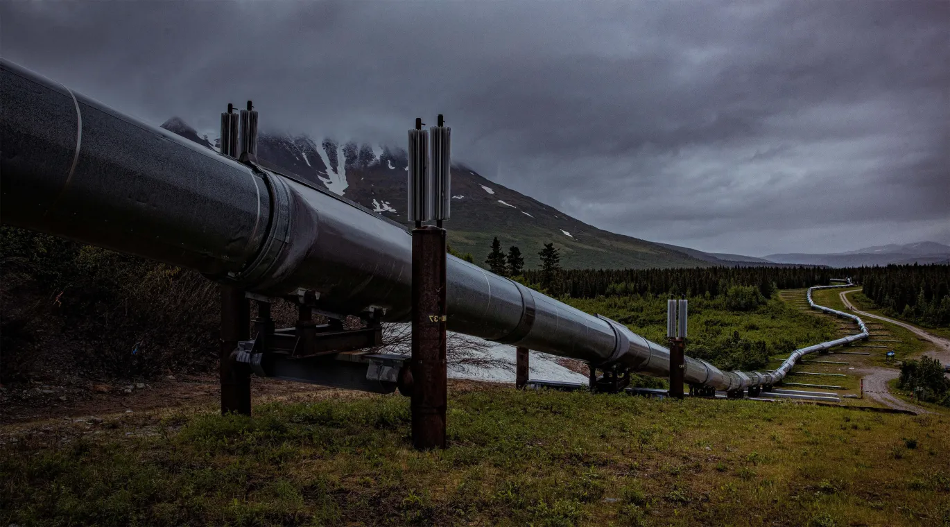 Remote oil pipeline infrastructure in mountainous terrain requiring reliable satellite connectivity.
