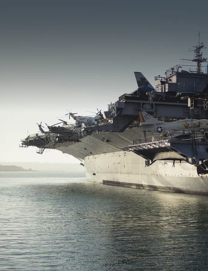 American navy ship with airplanes and helicopters at sea