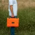Starlink Mini Star-Batt carried by a man outside