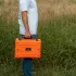 Starlink Mini Star-Batt carried by a man outside